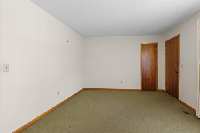 spare room with carpet floors