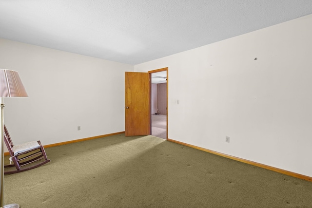 unfurnished room with carpet floors