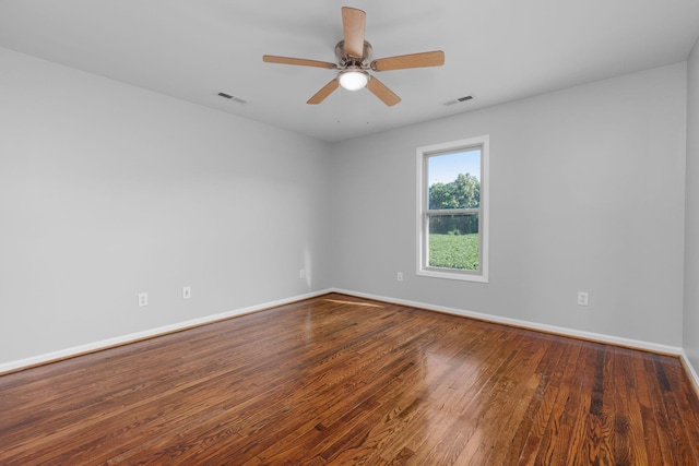 spare room with hardwood / wood-style floors and ceiling fan