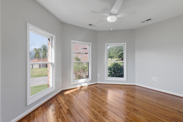 unfurnished room featuring ceiling fan and wood-type flooring