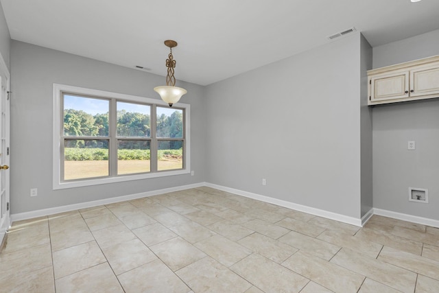 unfurnished dining area with light tile patterned floors