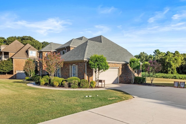 view of front of property featuring a front lawn and a garage