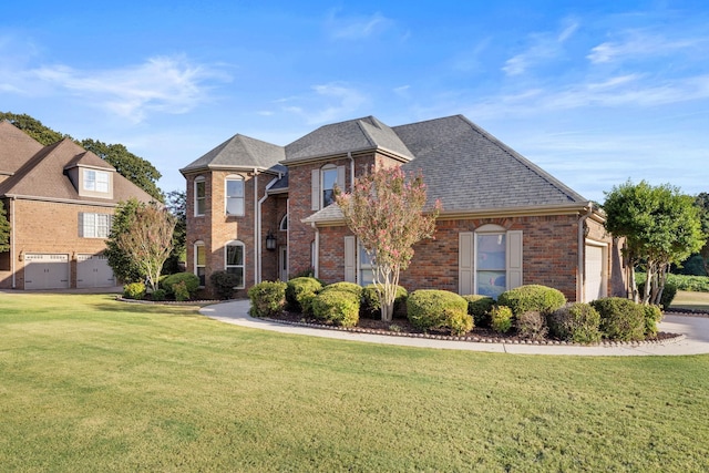 view of front property with a front yard and a garage