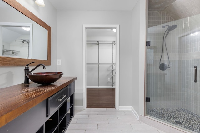 bathroom with vanity and walk in shower