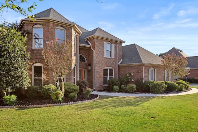 view of property featuring a front yard