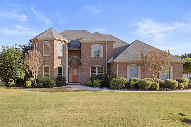 front facade with a front yard