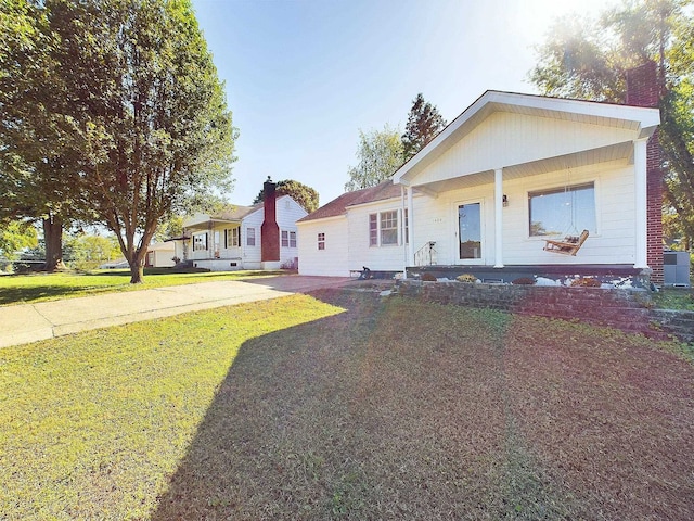 view of front of home with a front yard and a porch