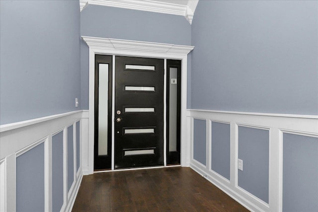 foyer featuring dark hardwood / wood-style floors and crown molding