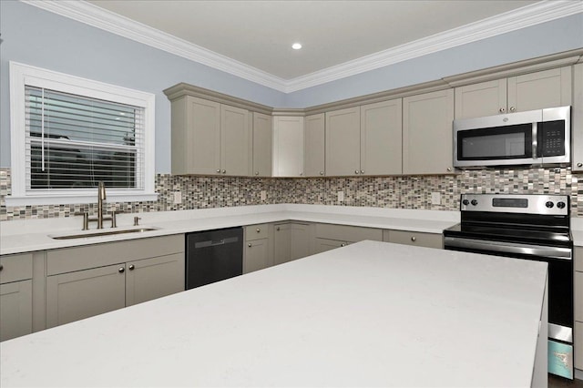 kitchen featuring gray cabinetry, backsplash, crown molding, sink, and appliances with stainless steel finishes