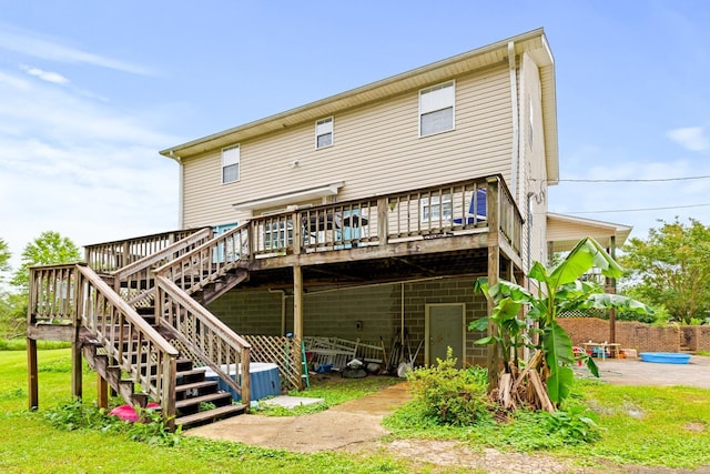  - rear view of property featuring a wooden deck and stairs