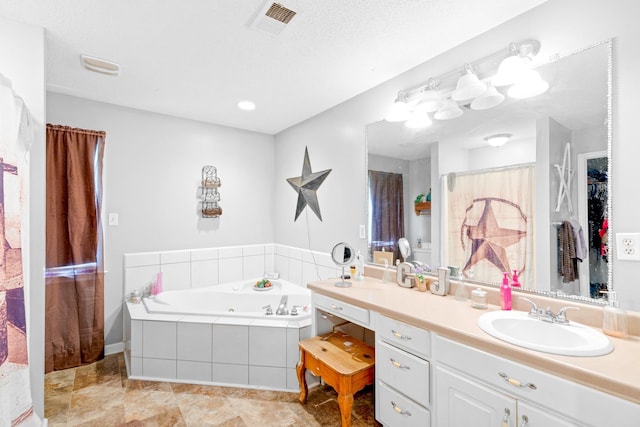  - full bathroom featuring vanity and a whirlpool tub
