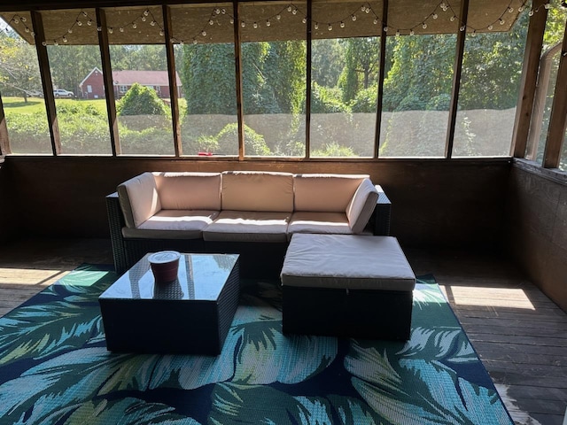  - sunroom featuring an outdoor hangout area and a wealth of natural light