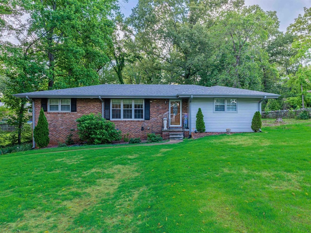 - ranch-style home featuring brick siding