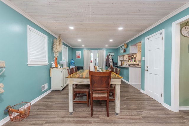  - dining area with crown molding, wood finished floors, recessed lighting, baseboards, and wooden ceiling