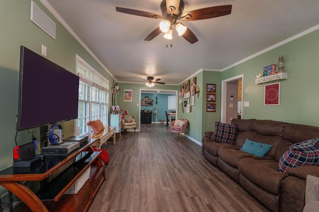  - living room with ceiling fan, dark wood-style floors, crown molding, baseboards, and a textured ceiling