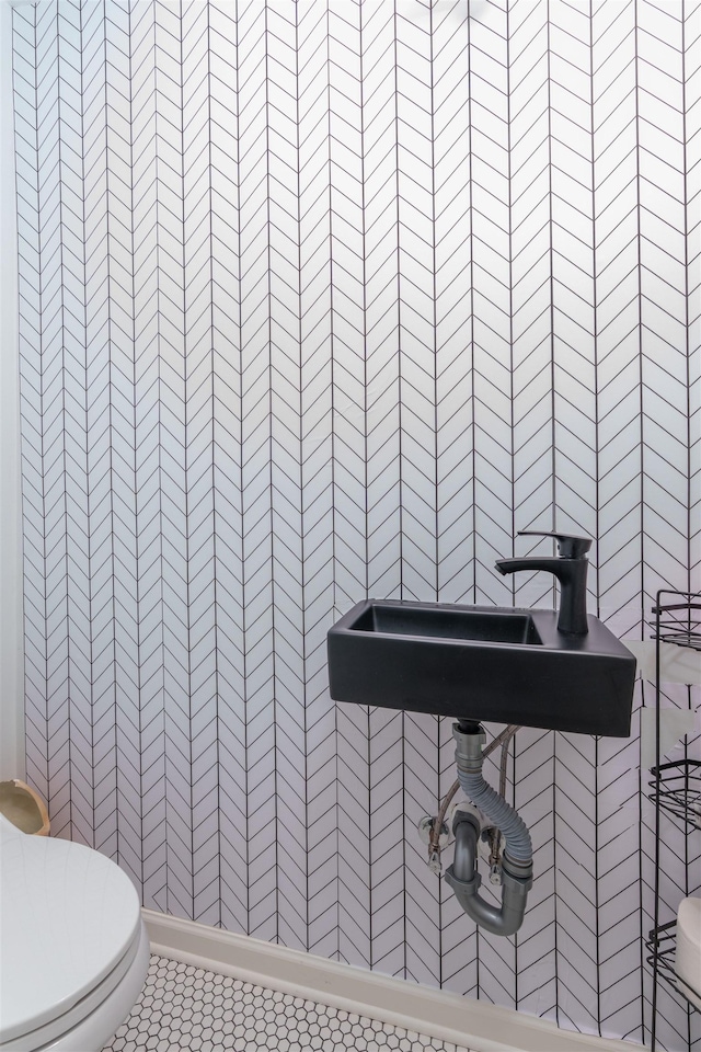  - half bathroom with toilet and tile patterned floors