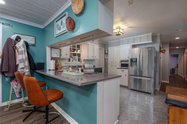  - kitchen with stainless steel fridge, crown molding, white cabinets, a peninsula, and a breakfast bar