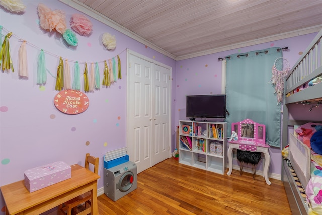  - bedroom featuring wood finished floors, a closet, wooden ceiling, and baseboards