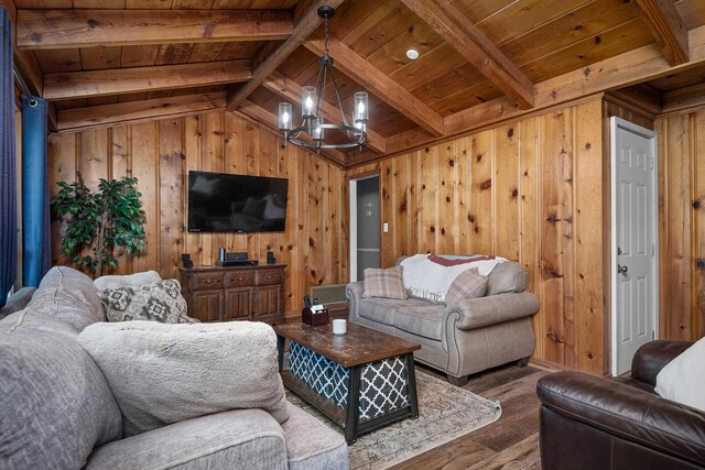 living room with wood walls, wood finished floors, wood ceiling, and an inviting chandelier