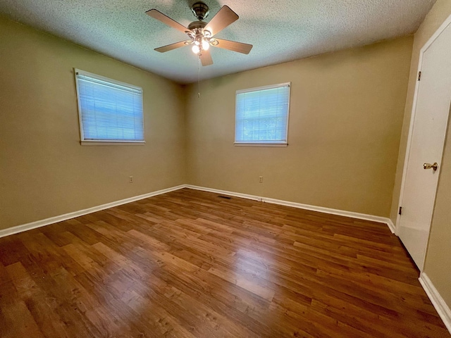  - unfurnished room with wood finished floors, ceiling fan, and a textured ceiling