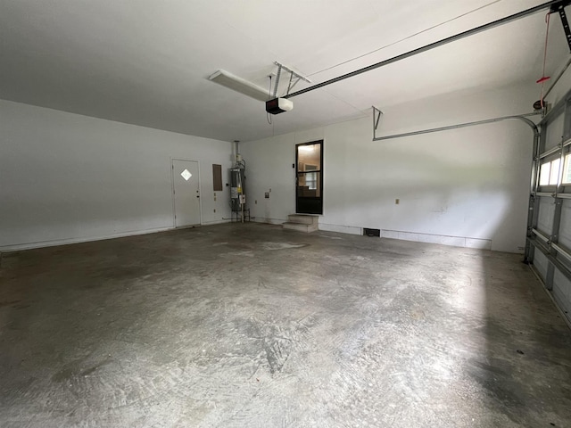  - garage featuring electric water heater and a garage door opener