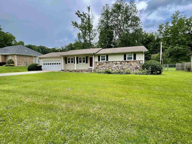  - view of front of house with a garage, stone siding, and driveway