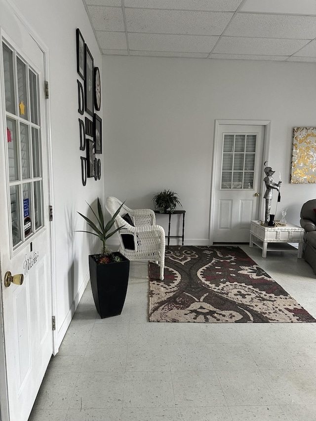 interior space featuring a drop ceiling