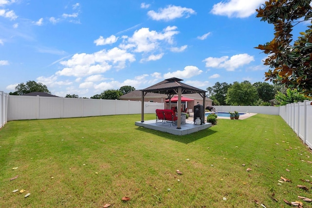  - fenced backyard featuring a gazebo and a patio