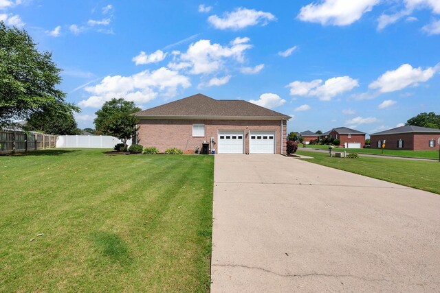  - view of property exterior featuring driveway, an attached garage, and brick siding