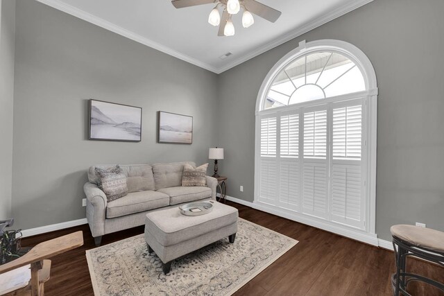  - living area featuring a ceiling fan, ornamental molding, and dark wood-style flooring