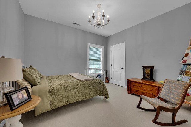  - bedroom with carpet floors and a chandelier