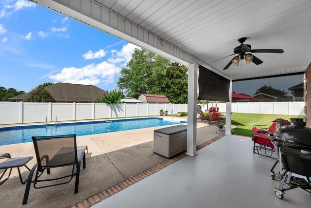  - view of swimming pool featuring a fenced backyard, a grill, a patio area, and ceiling fan