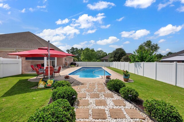  - view of swimming pool with a patio area and a fenced backyard
