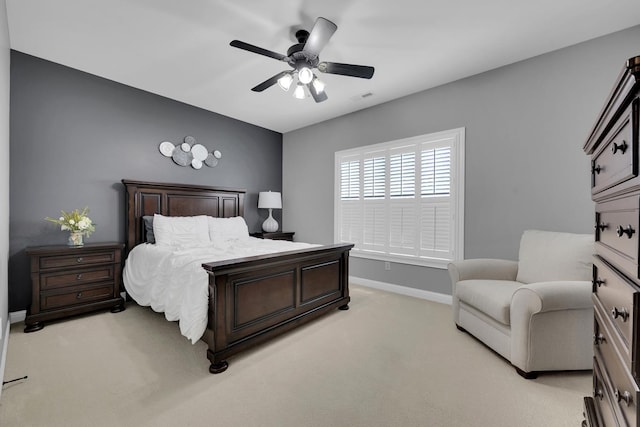  - bedroom with light colored carpet and ceiling fan