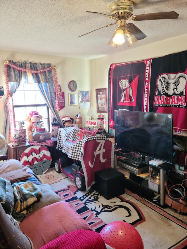 living room with a textured ceiling and ceiling fan