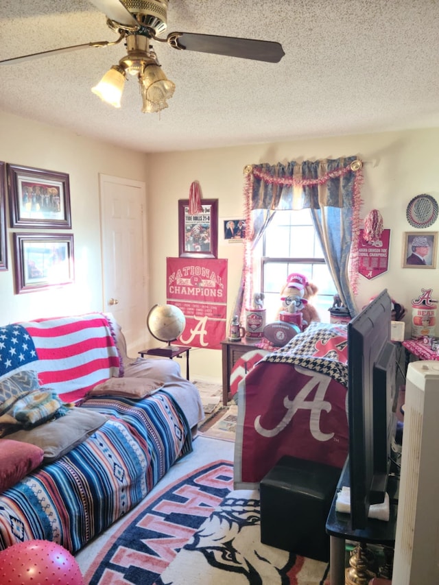 bedroom featuring a textured ceiling and ceiling fan