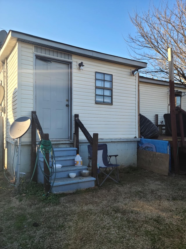 rear view of house with a yard