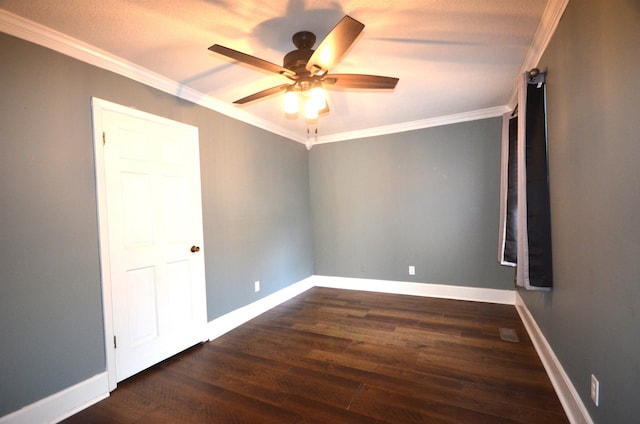 spare room with crown molding, dark hardwood / wood-style floors, and ceiling fan