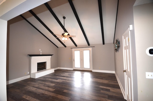 unfurnished living room with dark wood-type flooring, ceiling fan, high vaulted ceiling, a brick fireplace, and beamed ceiling