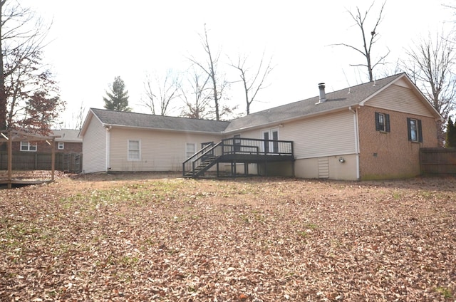 back of house featuring a wooden deck