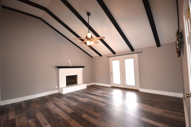 unfurnished living room with beam ceiling, a fireplace, dark hardwood / wood-style floors, and ceiling fan