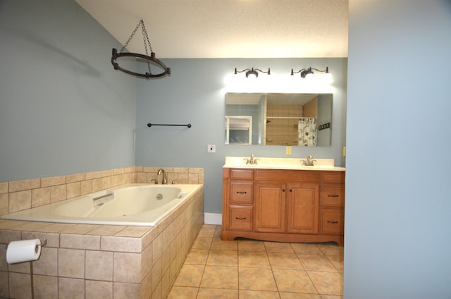 bathroom with vanity, tile patterned floors, independent shower and bath, and a textured ceiling