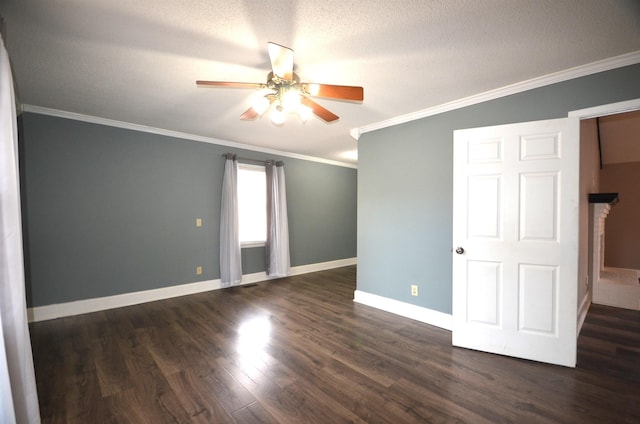 empty room with crown molding, ceiling fan, dark wood-type flooring, and a textured ceiling