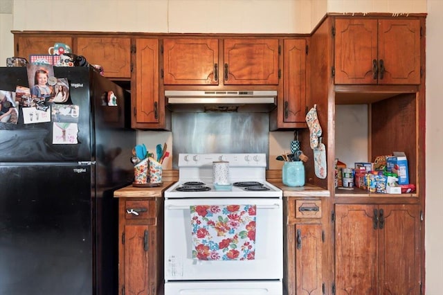 kitchen with black refrigerator and white electric stove