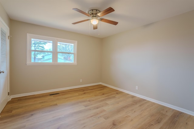 spare room with light hardwood / wood-style floors and ceiling fan