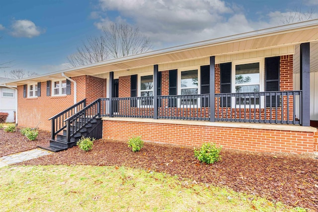 ranch-style home with a porch