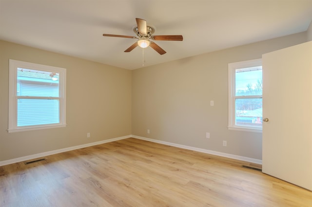 spare room featuring ceiling fan and light hardwood / wood-style floors