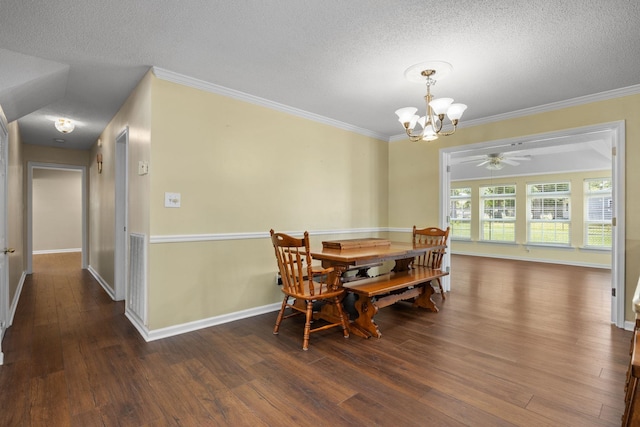 dining area featuring a textured ceiling, crown molding, dark hardwood / wood-style flooring, and ceiling fan with notable chandelier