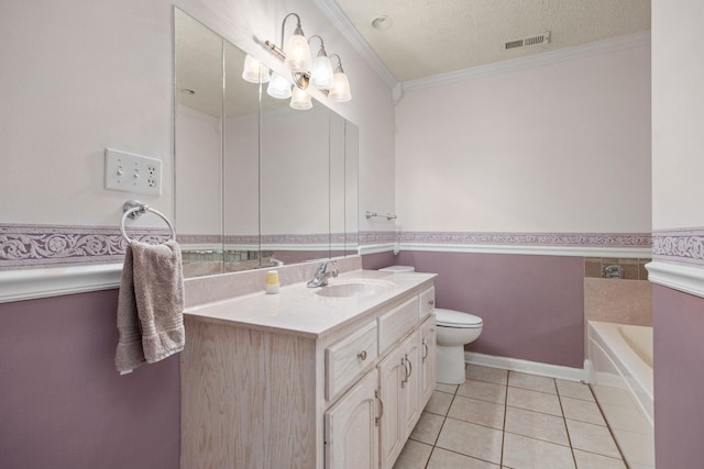 bathroom with vanity, crown molding, tile patterned flooring, toilet, and a textured ceiling