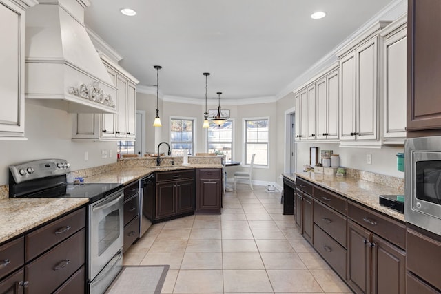 kitchen featuring premium range hood, crown molding, decorative light fixtures, light tile patterned floors, and appliances with stainless steel finishes